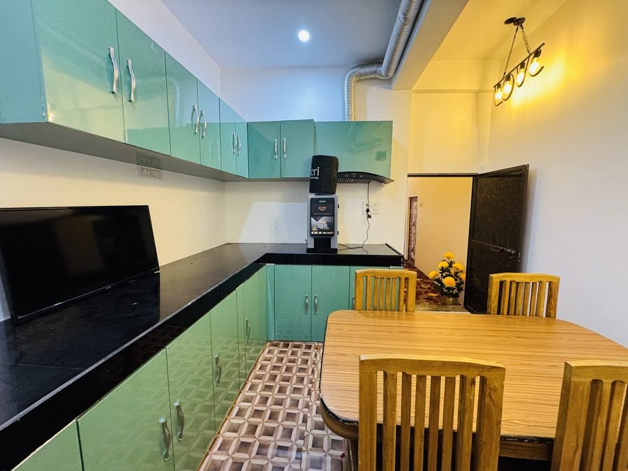 Cafeteria with coffee machine and seating at Cyber Gyaan